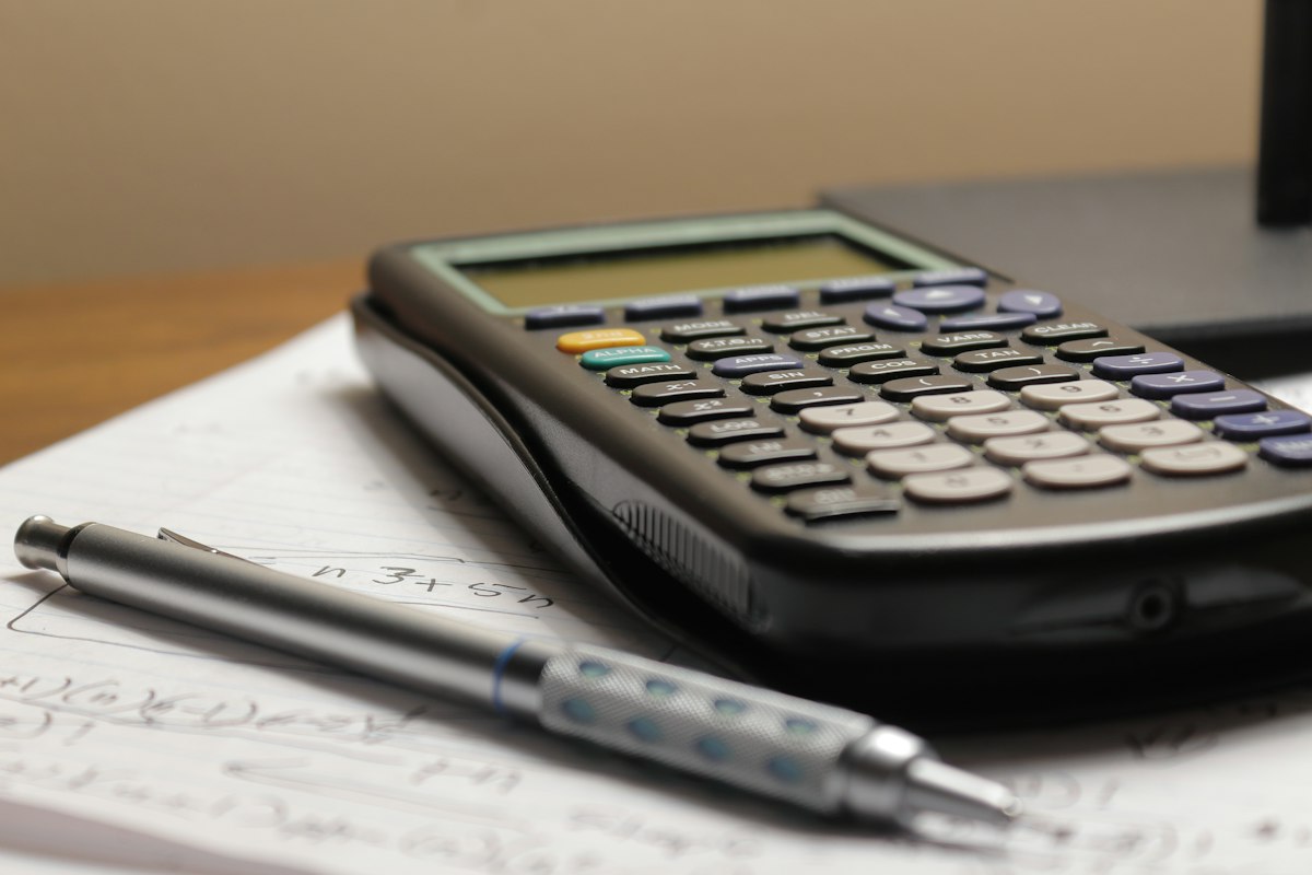 Calculator and financial charts for an economic expert report