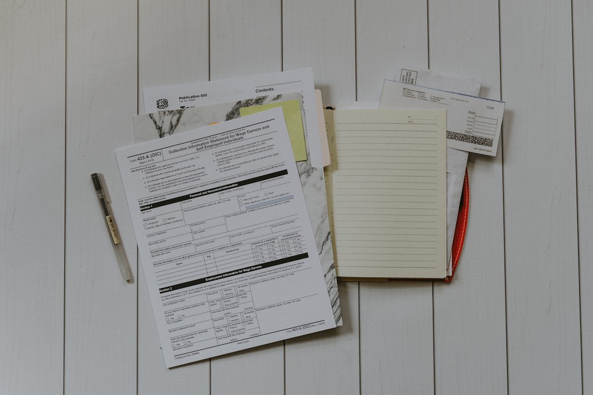 Invoices and receipts laid out on a desk